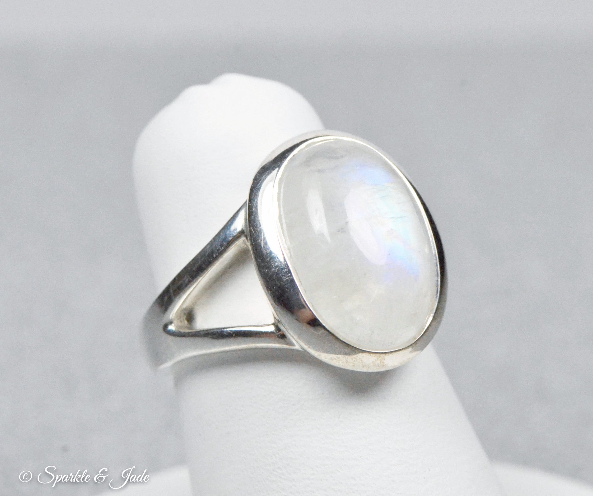 Beautiful oval rainbow moonstone ring with cubic zirconia top accents/925 sterling silver